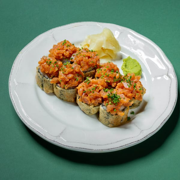Big Bang Sushi & Poke's fried sushi rolls topped with spicy salmon, chives, ginger, and wasabi.